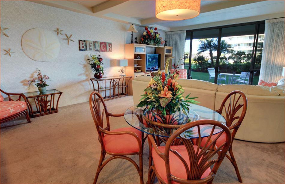 Furnished with classic Hawaii cane pieces this tropical ground floor condo is great for families or couples sleeps 2-4. 
