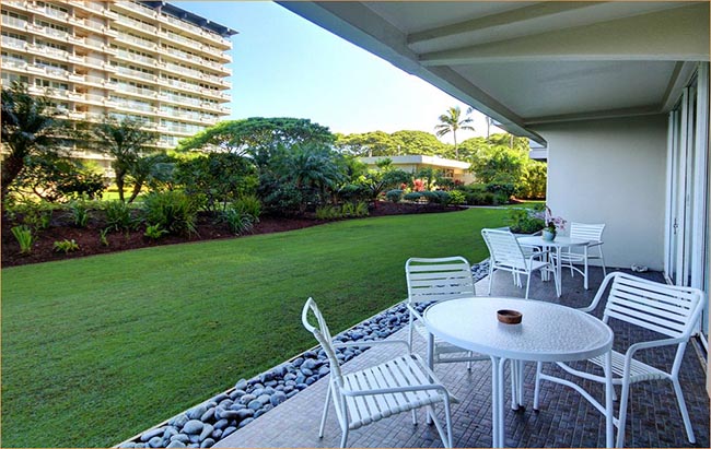 The open to the manicured lawns and sweet sea air.  Beach condo includes a private lanai.