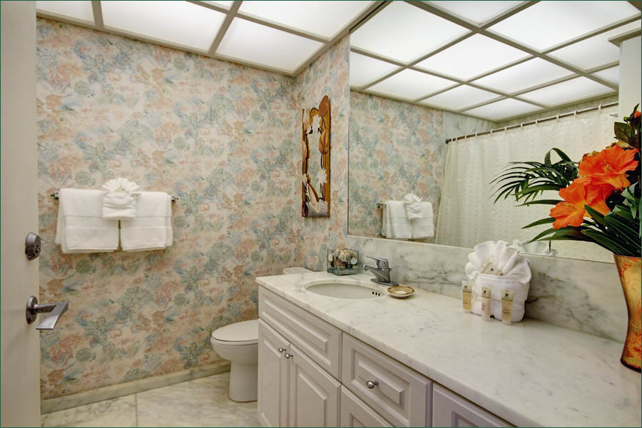 The master bathroom includes a full shower and tub and separate access to the front door.